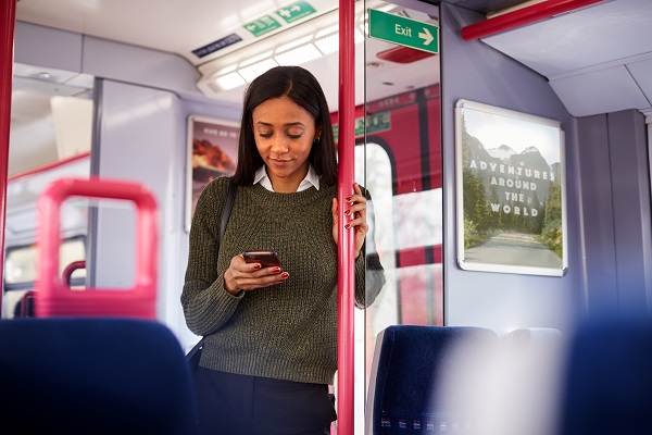 Woman using a mobile phone on a train